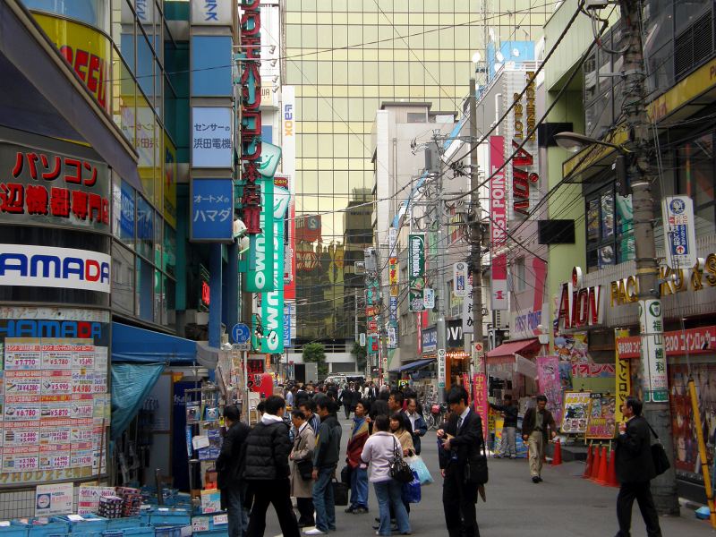 Akihabara Electric Town is a very 1980s looking city with a lot of large signage and telephone poles.