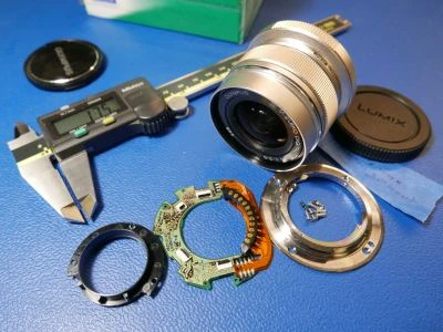 Olympus Lens disassembled on table